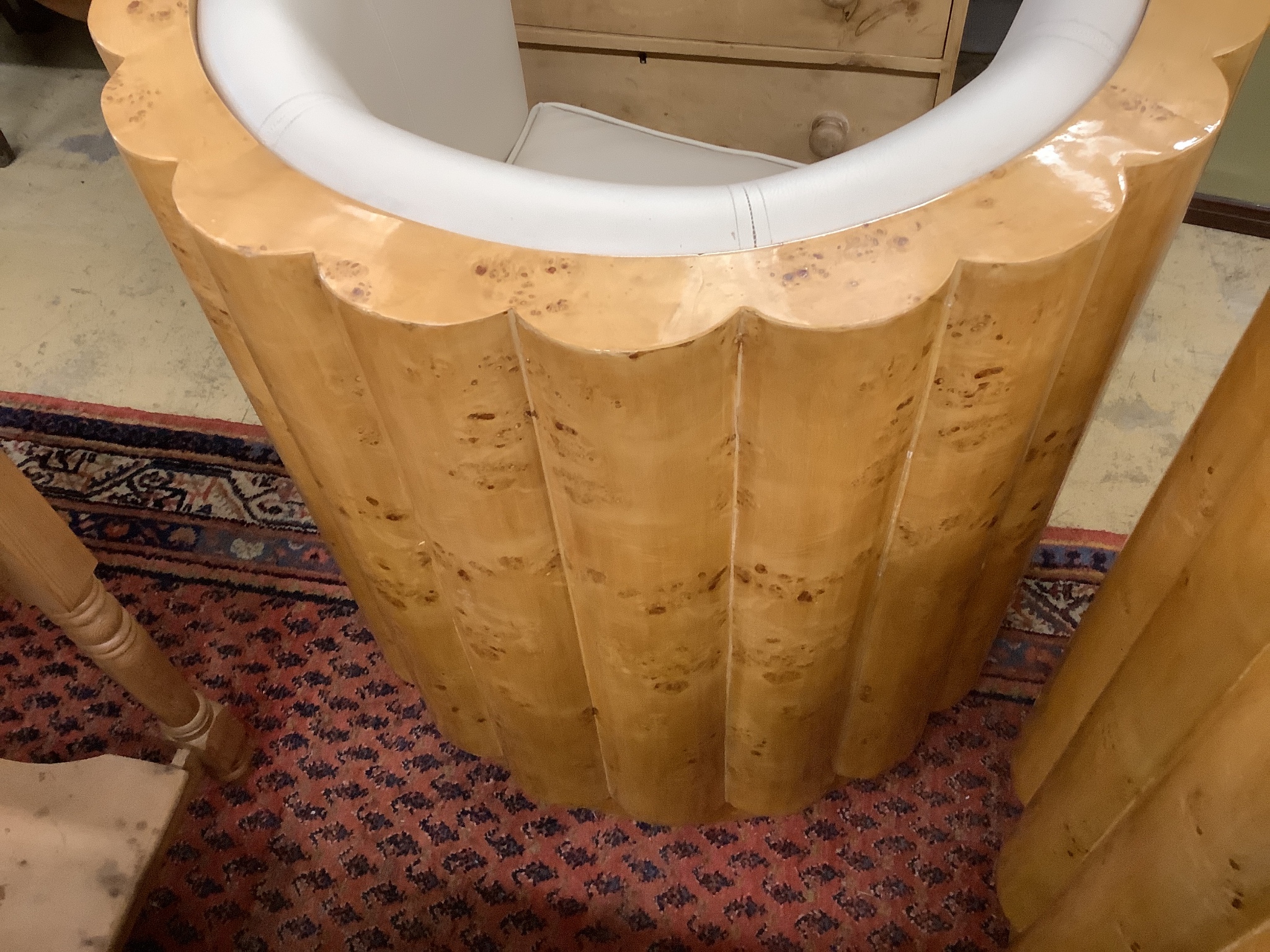 A pair of Art Deco style tub framed cream leather and maple chairs, width 84cm, depth 66cm, height 85cm